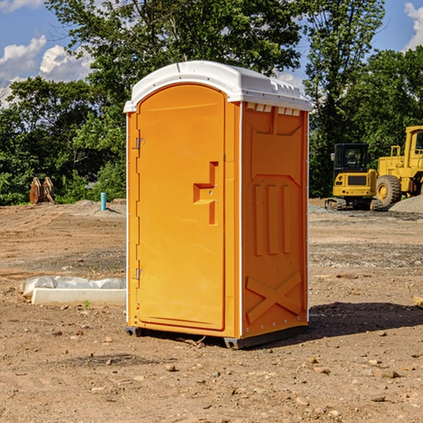 what is the cost difference between standard and deluxe portable restroom rentals in Russell